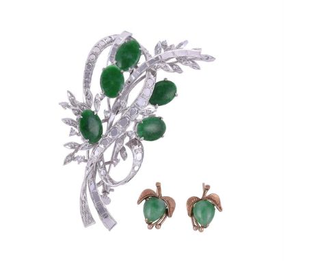 
	
		A 1970S JADEITE JADE AND DIAMOND SPRAY BROOCH 
		The scrolled foliate spray with oval cabochon jade panels and leaves se
