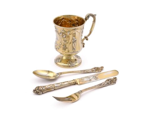 
	
		A CASED VICTORIAN SILVER GILT CUP, KNIFE, FORK AND SPOON
		GEORGE ADAMS, LONDON 1869
		The cup with a double scroll hand
