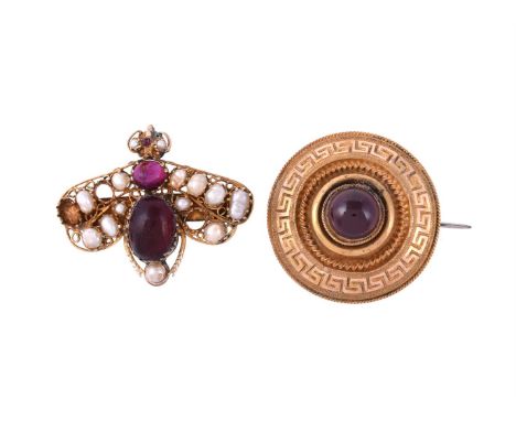 
	
		TWO GARNET SET BROOCHES
		The first a Victorian circular brooch, circa 1870, the circular cabochon garnet within a Greek