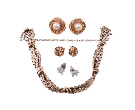 
	
		A SMALL COLLECTION OF JEWELLERY
		Comprising a bracelet by UnoAErre, the crossover fancy textured links with polished cr