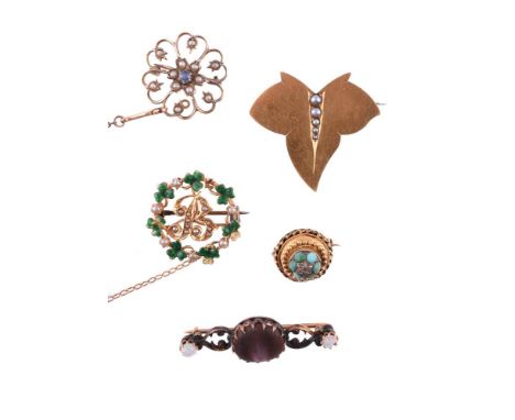 
	
		Y&nbsp;A COLLECTION OF FIVE VICTORIAN AND LATER BROOCHES
		The first a Victorian gold ivy leaf brooch, circa 1870, set w