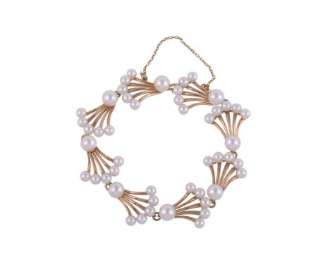 
	
		MIKIMOTO, A CULTURED PEARL BRACELET
		The pierced fan shaped panels with cultured pearl accents, stamped with Mikimoto m