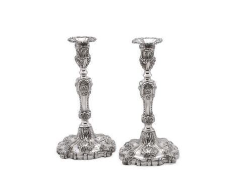 
	
		A PAIR OF VICTORIAN SILVER CANDLESTICKS
		H. J. LIAS &amp; SON, LONDON 1855
		With shaped circular sconces, the capitals