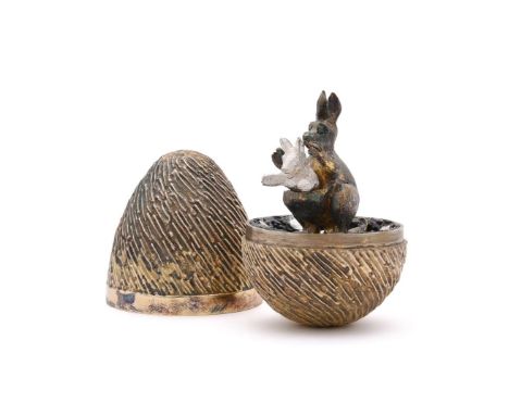 
	
		A LIMITED EDITION SILVER GILT SURPRISE EGG 
		STUART DEVLIN, LONDON 1974, NO. 110/300
		Opening to a kangaroo and joey
	