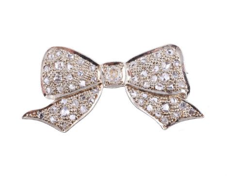 
	
		A DIAMOND BOW BROOCH
		The bow set throughout with rose cut diamonds, with a central old mine cut diamond, estimated to 