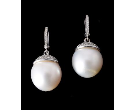 
	
		A PAIR OF SOUTH SEA CULTURED PEARL AND DIAMOND EARRINGS
		the South Sea cultured pearls with brilliant cut diamond caps,