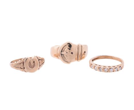 
	
		THREE GOLD COLOURED RINGS
		The first with brilliant cut diamonds, approximately 0.17 carats total, Birmingham 1984; the