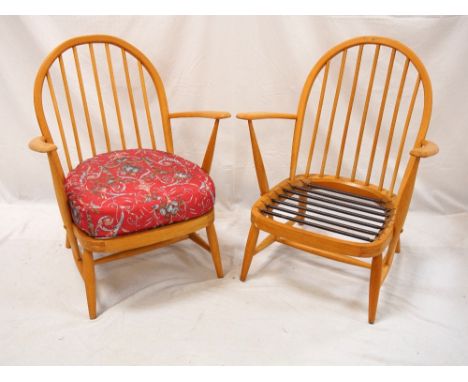 PAIR OF ERCOL STYLE SPINDLE BACK ARMCHAIRS
raised on turned supports with stretchers, one chair with floral fabric covered se