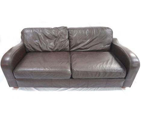 LARGE LEATHER SOFA
in dark brown with loose cushions, standing on shaped squat supports, 200cm wide  