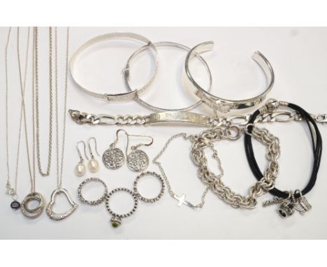 SELECTION OF SILVER JEWELLERY
including three Pandora silver rings, a Pandora cord bracelet with silver charms, a silver bang