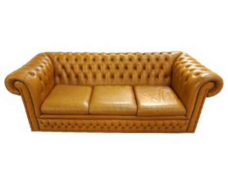 LEATHER THREE SEATER CHESTERFIELD SOFA
with button back detail, scroll arms with studwork detail and three loose seat cushion