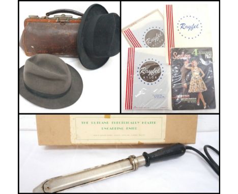 VINTAGE LEATHER GLADSTONE BAG
with carrying handle and sliding locks to the metal frame, a black felt hat bearing a trade lab