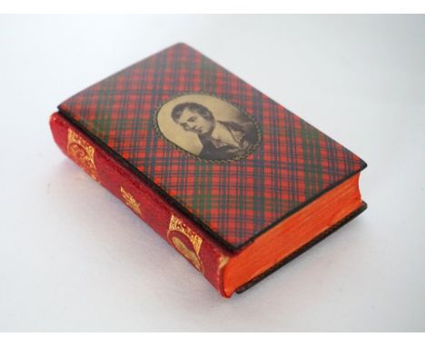 EDWARDIAN TARTAN WARE BOOK
The Poetical Works of Robert Burns marked to the leather spine, Ross tartan cover with an oval por