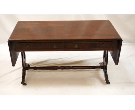 MAHOGANY SOFA TABLE
with shaped reeded flaps above two cockbeaded frieze drawers with opposing dummy drawers, standing on lyr