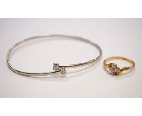 ITALIAN NINE CARAT WHITE GOLD STONE SET BANGLE
approximately 2.1 grams, and a stone set yellow gold ring marked with a star a