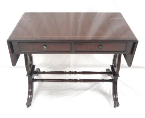 MAHOGANY SOFA TABLE
one side with two single drawers, the opposing side with false drawer facing, raised on shaped ends, turn