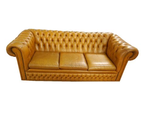 LEATHER THREE SEATER CHESTERFIELD SOFA
with button back detail, scroll arms with studwork detail and three loose seat cushion