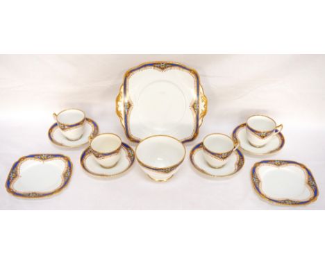 VINTAGE 'STANDARD' CHINA TEA SET
with fruit and gilt decoration on white ground, comprising eight cups, twelve saucers, twelv