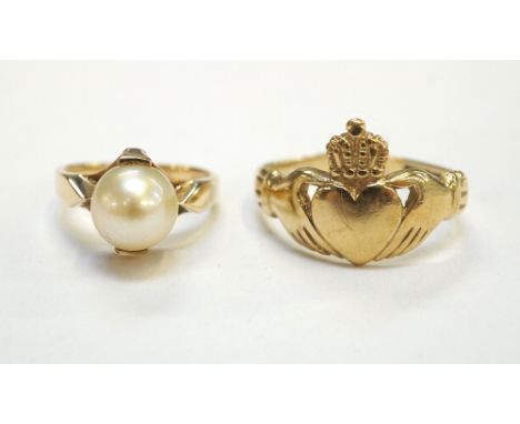 TWO NINE CARAT GOLD RINGS
one a Claddagh ring and the other set with a pearl, ring sizes Q and H respectively (2)