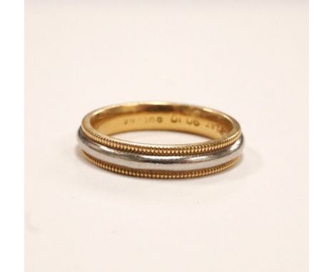 EIGHTEEN CARAT GOLD AND PLATINUM WEDDING BAND
ring size K-L