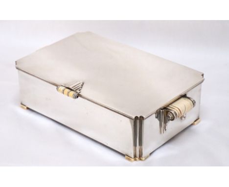 ART DECO SILVER CIGARETTE BOX
the hinged lid with ivory mounted handle and bearing engraved inscription to inner side 'Lang m