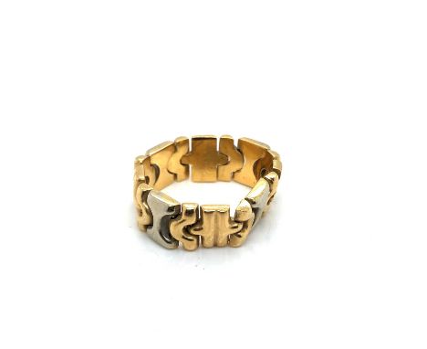 A two-colour flexi ring. The ring stamped 750, assessed as 18ct gold. Finger size R leading edge. Weight 6.74 grams.