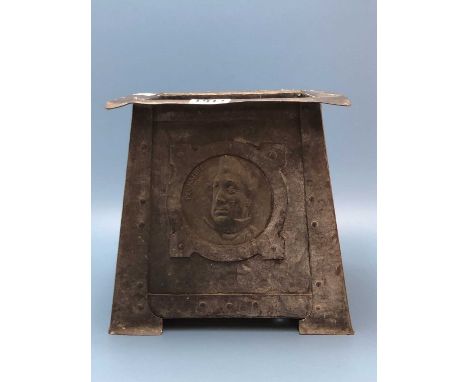 An Arts and Crafts copper planter, the square flat rim over panel sides flaring down to the feet and rivetted with Dickensian