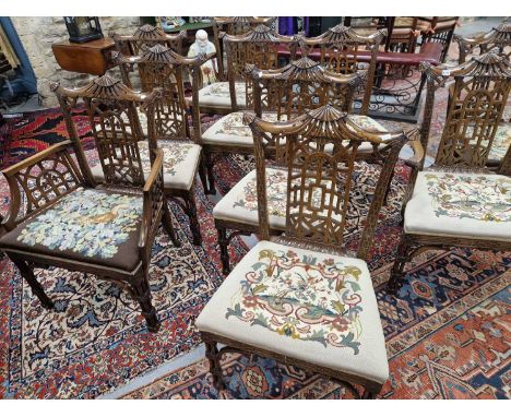 A set of ten mahogany Chinese Chippendale style chairs, to include four with arms, each with needle work seats together with 