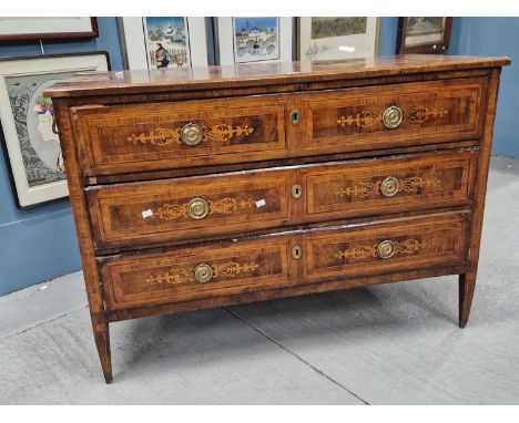 A late 18th C. Italian marquetried walnut chest of three long drawers, each inlaid with two foliage panels about the brass ri