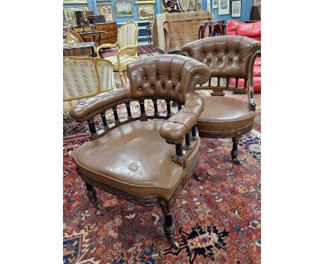 A Victorian partially ebonised mahogany desk chair ensuite with a chair without arms, both with backs button upholstered in b