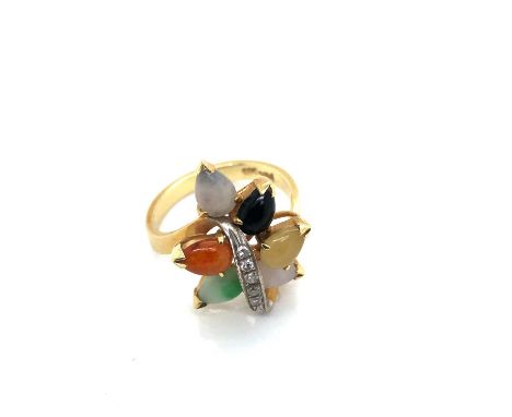 A jadeite and diamond ring. The crossover ring with six coloured jadeite pendeloque cabochons, lavender, yellow, black, mutto