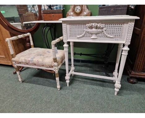 A 20th C. white painted planter table with a metal liner, the caned sides applied with a bowl of flowers above fluted cylindr