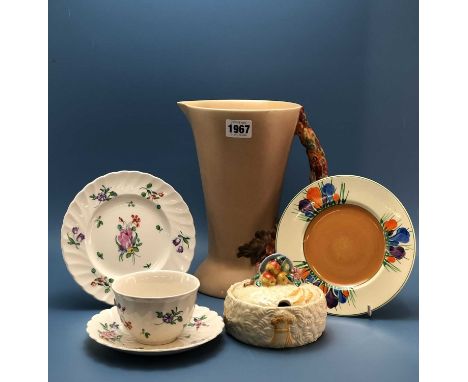 Clarice Cliff: a jug with a floral handle, a preserve pot and cover, a crocus pattern tea plate together with a Duvivier patt