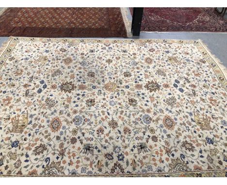 A Continental knotted carpet of Persian hunting design. 395 x 295 cm