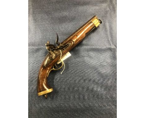 A 19th-century Flintlock, East India Company new land pattern pistol. The walnut stock with brass pommel and lanyard ring. Ra