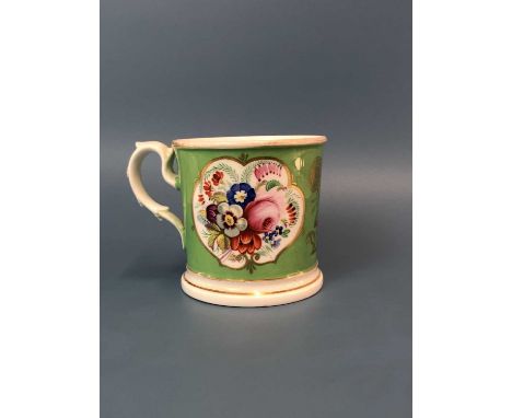 Two Staffordshire porcelain cottage pastille burners together with a Coalport green ground mug painted with reserves of flowe