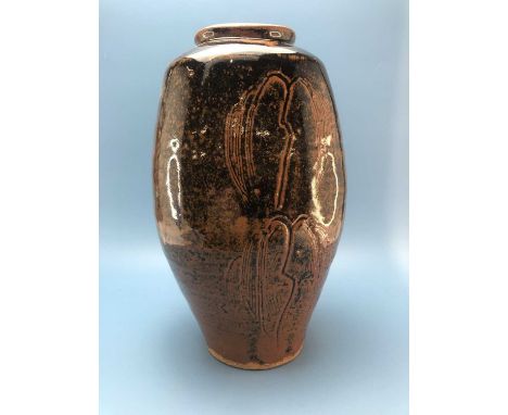 A Bernard Leach temmoku glazed vase, each of the flattened sides of the ovoid shape incised with pairs of willow trees, impre