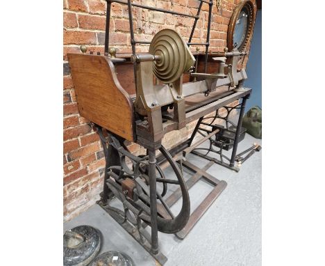 A rare mid-19th century brass and iron ornamental turning lathe signed C. Rich, 44 Denmark Street London. Mounted on a decora