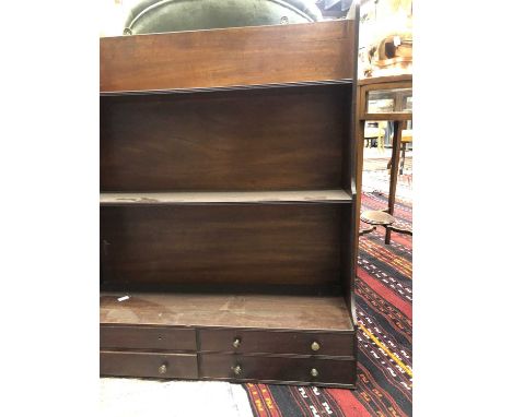 A Regency mahogany wall hanging shelf, the three graduated tiers with a bank of four small drawers below, 81.5cm high x 70cm 