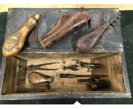 An embossed copper powder flask signed Hawksley, Sheffield, A leather shot flask, A further two shot flask tops, a copper pow
