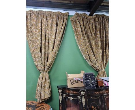 A pair of floral brocade lined curtains
