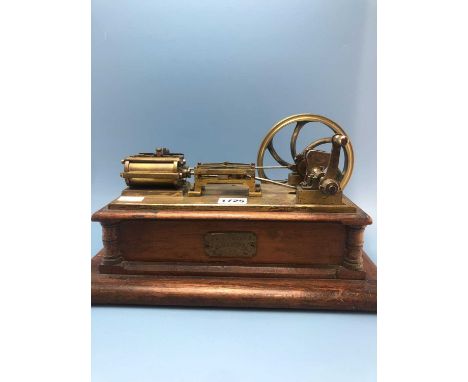 An antique hand-made steam engine brass piston action scale model pump engine by E A Nehan, 1904, mounted on a mahogany recta