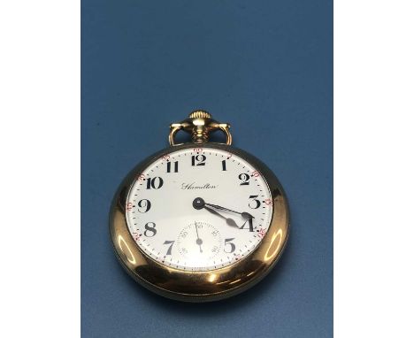 A Hamilton open-faced pocket watch in a gold-filled case, the top winding movement with 21 jewels.