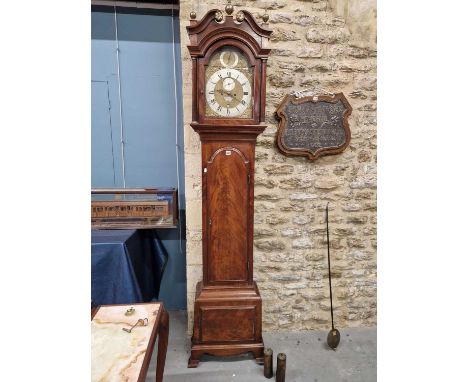 An 18th C. mahogany long cased clock, the arched brass dial inscribed for Joseph Ridley London, the strike/silent dial above 