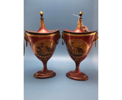 A pair of 19th C. tole chestnut urns and covers painted in sepia with ovals of cottages on one side and landscapes on the oth