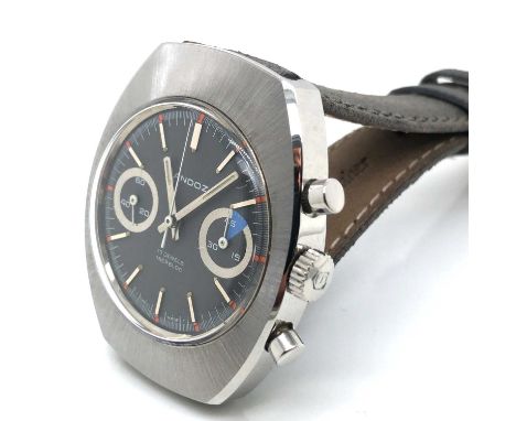 A Henri Sandoz wristwatch. Circa 1974. The chronograph dial grey dial in stainless steel case. Diameter 36 42 mm. The manual 