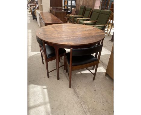 A McINTOSH RETRO EXTENDING DINING TABLE AND FOUR DINING CHAIRS 