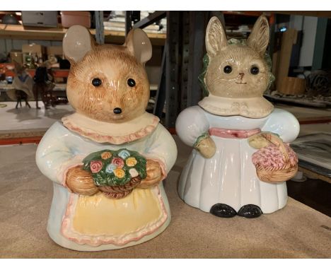 TWO LIDDED CERAMIC BISCUIT BARRELS IN THE FORM OF ANIMAL CHARACTERS 
