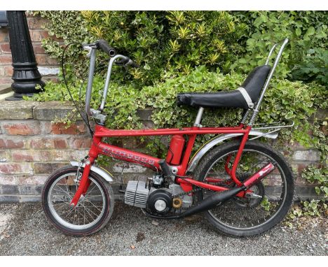 A MOTORISED CHOPPER BICYCLE WITH FACTORY FITTED ENGINE 