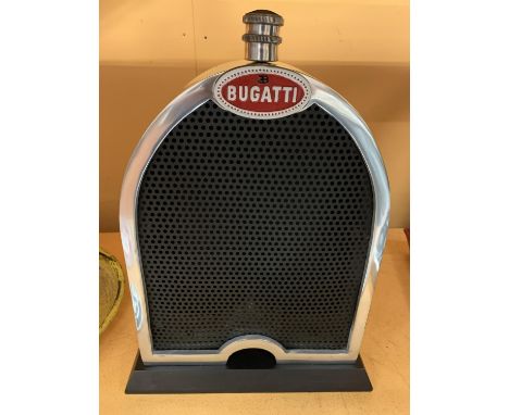 A BUGATTI STYLE RADIATOR AND GRILL ON A WOODEN BASE 
